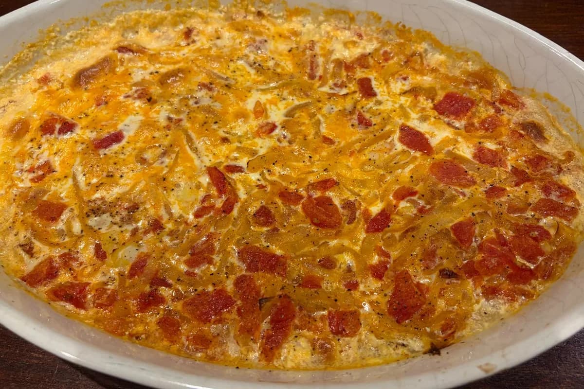 Pat's finished haddock and tomato bake bubbling in an oval ceramic dish